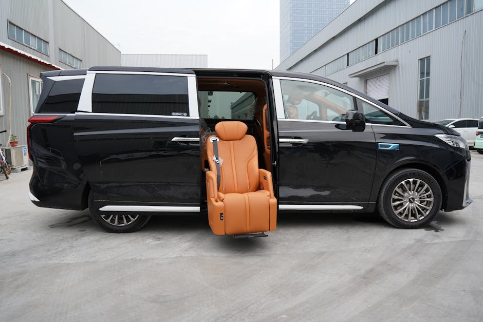 Black luxury minivan showcasing a unique swivel seat for easy access.
